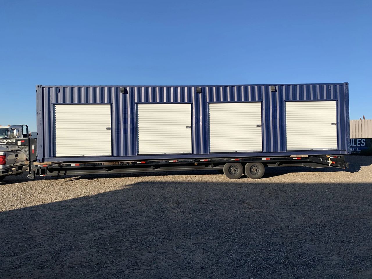 Custom modified storage container with roll-up door